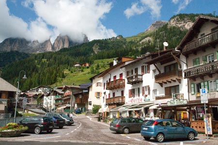 Pretty village of Campitello looking up Val Duron